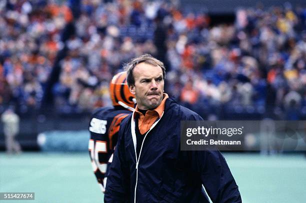 Sam Wyche, coach for the Cincinnati Bengals watches game from the sidelines.