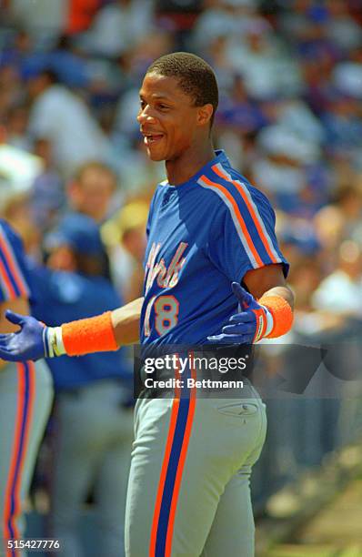 New York Mets outfielder Darryl Strawberry points to a fan in the stands as he comes off the field before the Mets game 3/9 against the Baltimore...