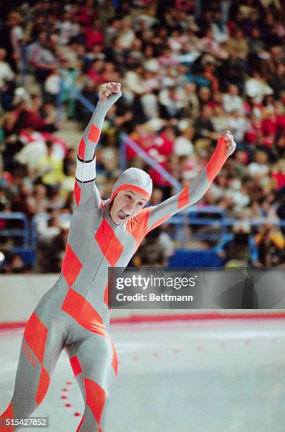 American speed skater Bonnie Blair raises her arms in victory after taking gold, and setting a new world record, in the 500-meter event at the 1988...