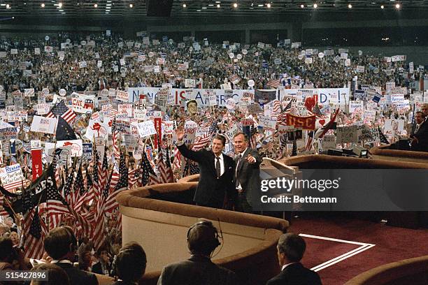 Dallas, TX- President Ronald Reagan and running mate Vice President George Bush wave to the gathered delegates 8/23 in the Dallas Convention Center...