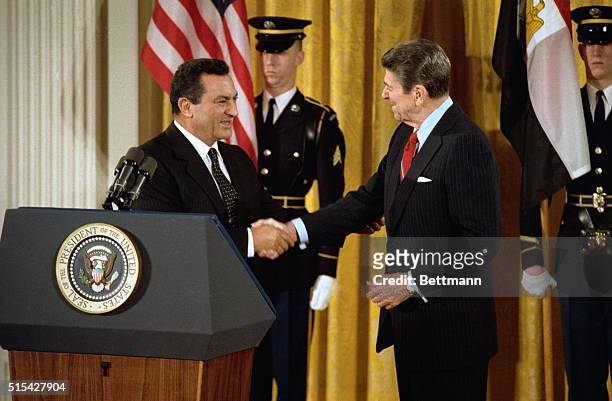 Washington: President Reagan greets Egyptian President Hosni Mubarak in a East Room ceremony.