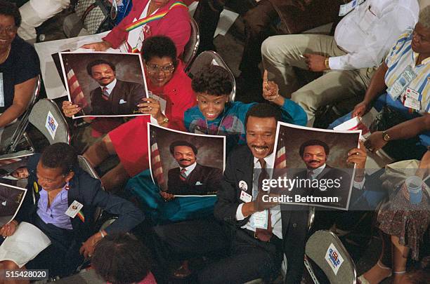 View of the Democratic National Convention in San Francisco, showing a group of people holding pictures of Jesse Jackson.