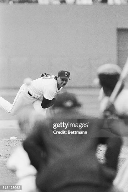 Boston Red Sox star pitcher Roger Clemens tosses first pitch to the plate here against Tiger's Gary Pettis during opening day at Fenway Park. The...