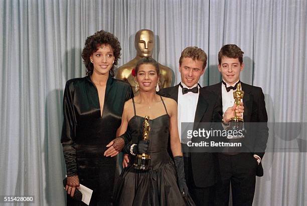 Winner of the Academy Award for the Best Song in a Movie, the writers of "Flashdance... What a Feeling," pose with presenters after the ceremony....
