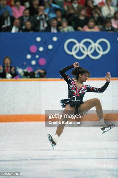 Calgary, Canada: Debi Thomas of the United States stumbles as she lands following a jump during her performance in the women's long program here...
