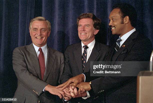 San Francisco, California: Democratic Presidential Candidates Walter Mondale, Jesse Jackson, and Gary Hart meet and shake hands during the Democratic...