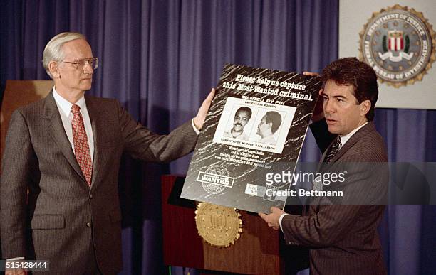 Washington: FBI Director William Sessions receives a poster of the most wanted criminal from John Walsh , who will be the host of a new TV program on...