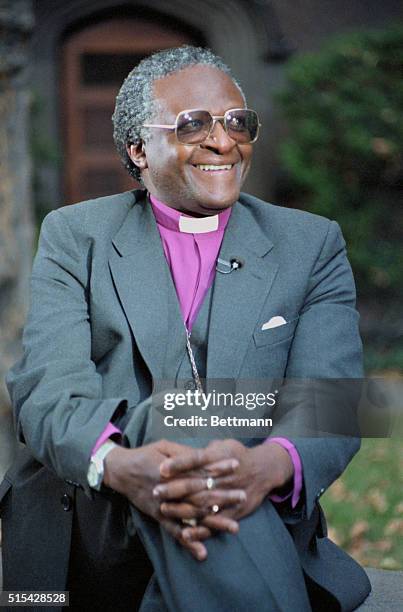 Anglican Bishop Desmond Mpilo Tutu smiles as he talks to press, October 16th, following his winning the Nobel Peace Prize for 1984.