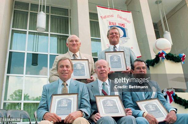 Inductees into the Baseball Hall of Fame at Cooperstown posing with their plaques. They are Rick Ferrell, Pee Wee Reese, Don Drysdale, Roy...