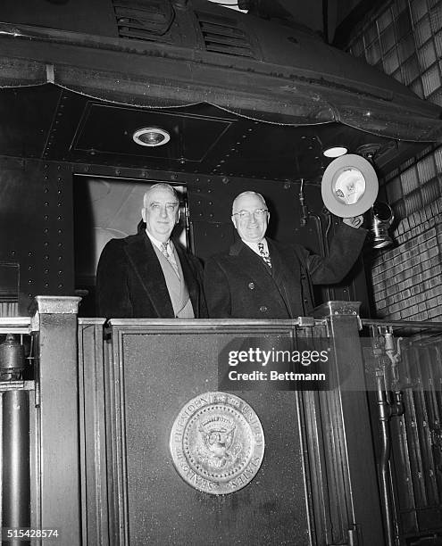 November 30, 1948-Washington D.C.: President Truman waves from train as he departs for Army-Navy game in Philadelphia, November 27th. With him is...