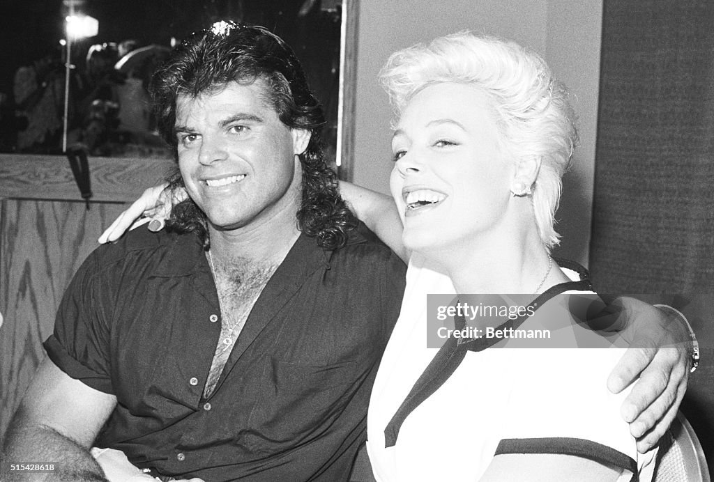 Mark Gastineau and Brigitte Nielsen Kissing