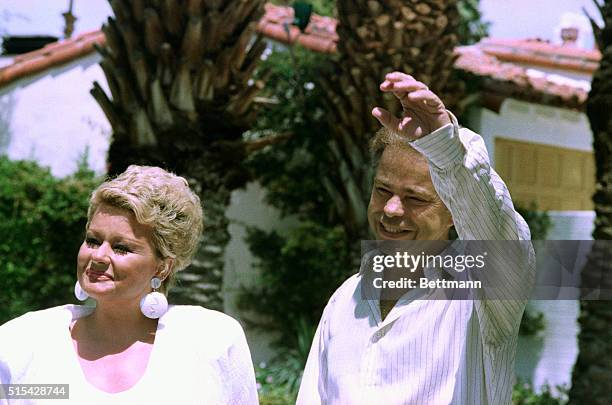 Fort Mill, S.C.: PTL founder Jim Bakker, foreground answers questions following a meeting with PTL trustee M.C. "Red" Benton, background following a...