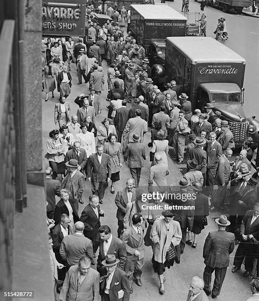 This is a typical noonday scene along Seventh Avenue, near 35th Street, in the heart of the city's garment district. David Dubinsky, President of the...