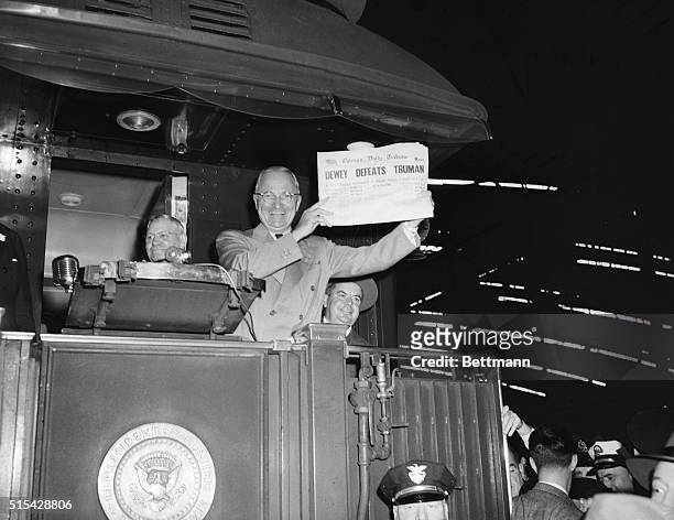 St. Louis, Mo: This photo of President Harry S. Truman laughing as he holds an early edition of the Chicago Tribune for Nov. 4th was taken by United...