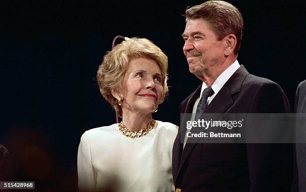 New Orleans, LA- Nancy Reagan looks up at her husband, President Reagan, with loving eyes as he makes a surprise visit to a party in Nancy's honor...