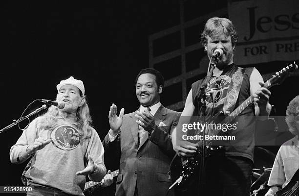 Los Angeles: Jesse Jackson claps along with Willie Nelson, , as Nelson and Kris Kristofferson, , sing a song about Jackson's life and his run for the...