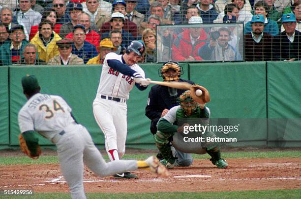 Boston: Oakland A's pitcher Dave Stewart strikes out BoSox slugger Wade Boggs with bases loaded in the 2nd inning of ALCS Game 1 at Fenway Park....