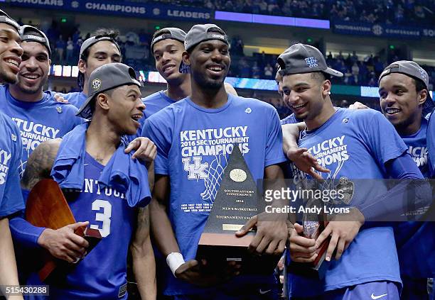 Tyler Ulis, Alex Poythress and Jamal Murray of the Kentucky Wildcats celebrate after the 82-77 OT win over the Texas A&M Aggies in the Championship...