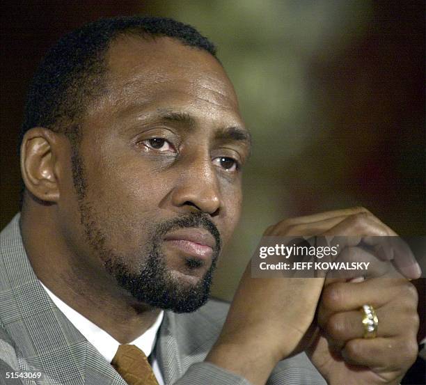 Thomas "Hit Man" Hearns sits at the podium at a news conference 24 February 2000 in Detroit, Michigan to announce that he will retire after his 25...