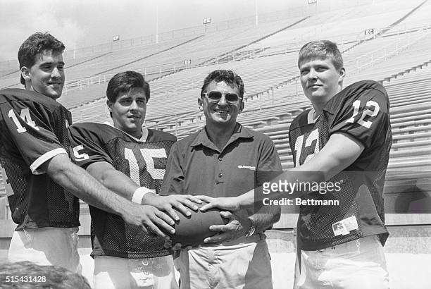 Penn State head coach Joe Paterno poses with his three quarterback hopefuls Doug Sieg, Lance Lonergan and Tom Bill during picture day at the...