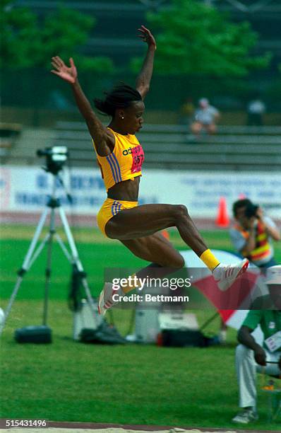 Jackie Joyner-Kersee sails through the air on her second attempt in the heptathlon long jump 7/16. Joyner-Kersee is on a record pace in the...