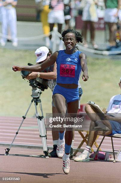 Jackie joyner-Kersee has a big smile as she hugs fellow heptathlete competitor Terri Turner after Joyner-Kersee set a new American record of 6feet 4...