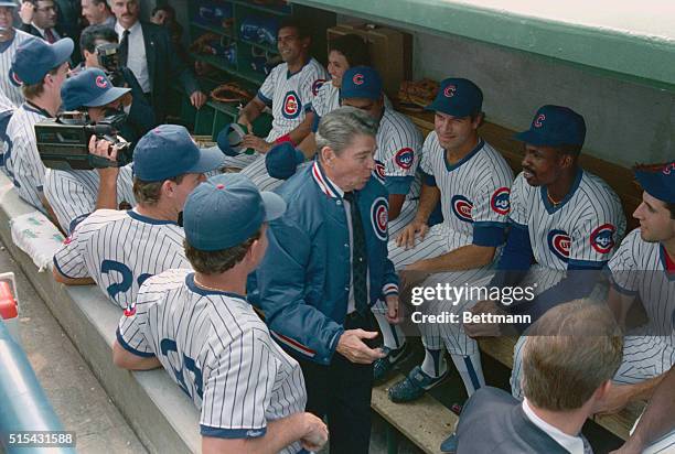 Chicago: President Ronald Reagan visits the Cubs' dugout during a surprise visit to Wrigley Field. After throwing out the ceremonial first pitch the...