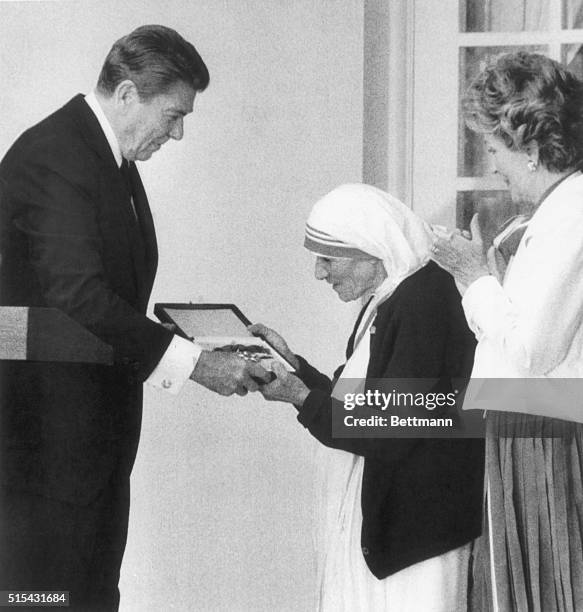 President Ronald Reagan presents the Medal of Freedom to Mother Teresa, the Roman Catholic nun who won the Nobel Peace Prize for her humanitarian...