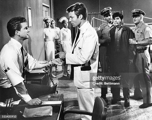 Richard Chamberlain and Leslie Nielsen in a scene from the television show Dr. Kildare.