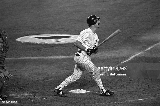 Yankees' Don Mattingly watches the ball go over the right field wall for his 6th grand-slam home run in the 3rd inning at Yankee Stadium 9/29. This...