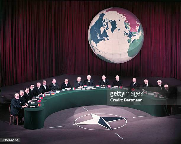 Heads of Government attending the NATO top-level meetings here gather at the Palais de Chaillot for the annual "Family Portrait". Left to right are;...