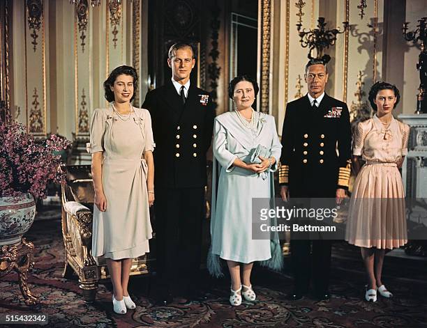 Photograph shows Princess Elizabeth, Lieutenant Philip Mountbatten, her then fiance, her mother, then Queen Elizabeth, now the Queen Mother, and her...