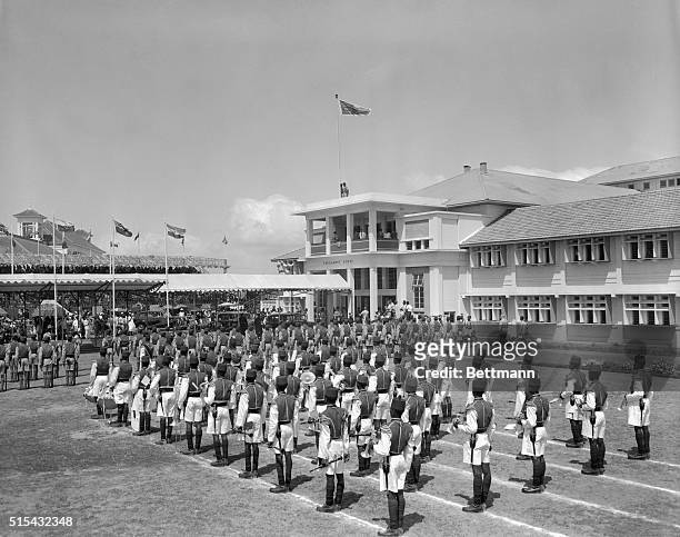 Accra, Ghana- The royal standard is lowered, and the flag of Ghana raised, as the Duchess of Kent leaves the assembly building after reading the...