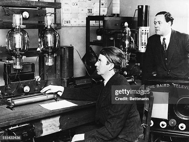 London, England- Photo shows Mr. J.L. Baird, inventor of television at left, with his assistant, Mr. B. Clapp, at the power plant at Couladon. Mr....