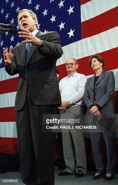 Republican presidential hopeful and Texas Governor George W. Bush addresses the crowd before financial supporter Alex Spanos and Bush's wife Laura 05...