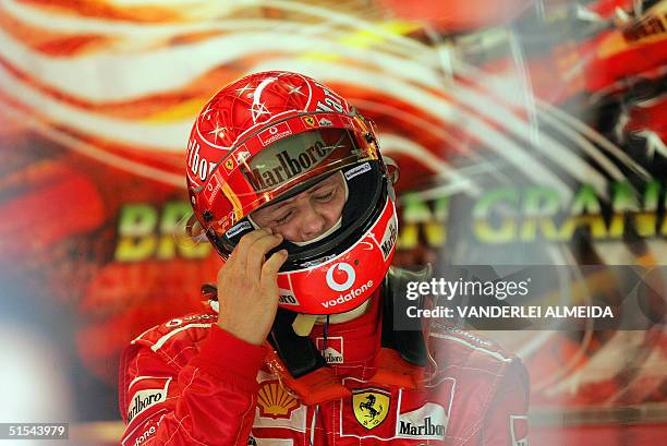 German Fast Driver German Formula One driver Michael Schumacher adjusts his helmet, 22 ...