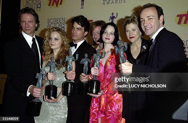 The cast of the film "American Beauty" Chris Cooper, Mena Suvari, Peter Gallagher, Allison Janney, Thora Birch, Annette Bening and Kevin Spacey hold...