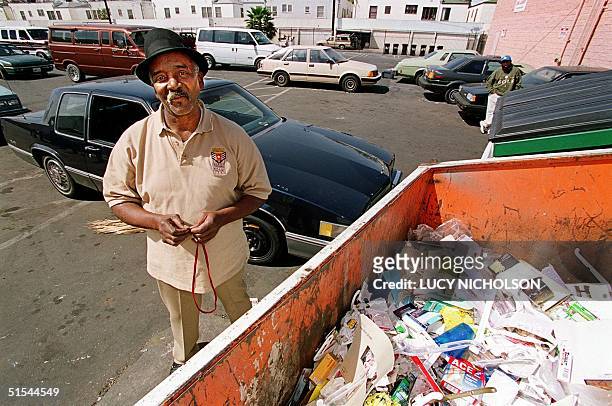 Willie Fulgear stands next to the dumpster where he found 55 stolen Oscar statuettes 20 March, 2000 in Los Angeles. Fulgear who rebuilds car parts,...