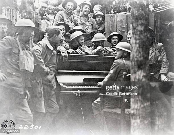 Troops of the 16th Infantry, 1st Division, United States Army around a piano abandoned by retreating German forces at Nonsard, north-eastern France,...