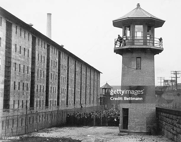 Ossining, New York- Counting the visitors to a football game in Sing Sing Prison. Close watch is kept on the visitors and they are counted several...