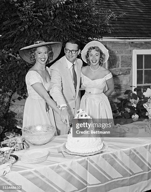 Waterford, CT- Video stars Jayne Meadows and Steve Allen are shown cutting their wedding cake shortly after their marriage here today, as the bride's...