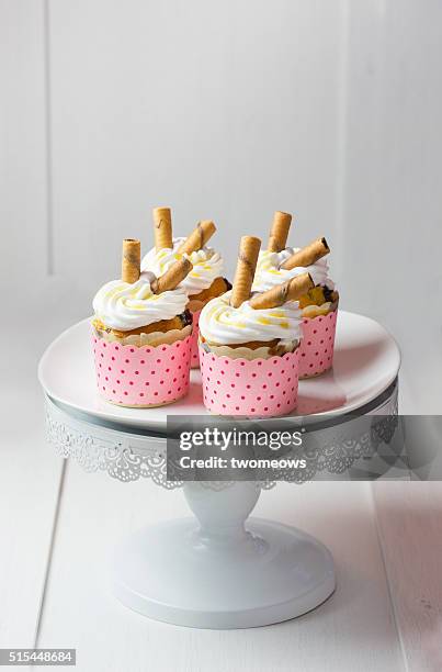 cupcakes with waffle rolls. - cakestand stock pictures, royalty-free photos & images