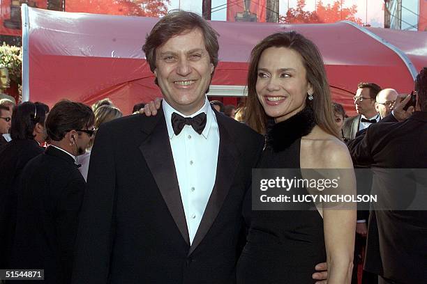 Swedish director Lasse Hallstrom arrives with wife Lena Olin at Shrine Auditorium for the Academy Awards in Los Angeles 26 March 2000. Hallstrom is...