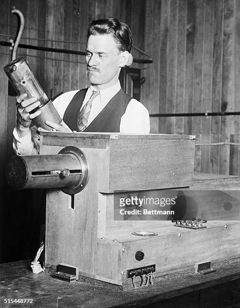 This photo shows Philo T. Farnsworth, Utah inventor, with the transmitting set of the apparatus that he recently developed for television, and which...