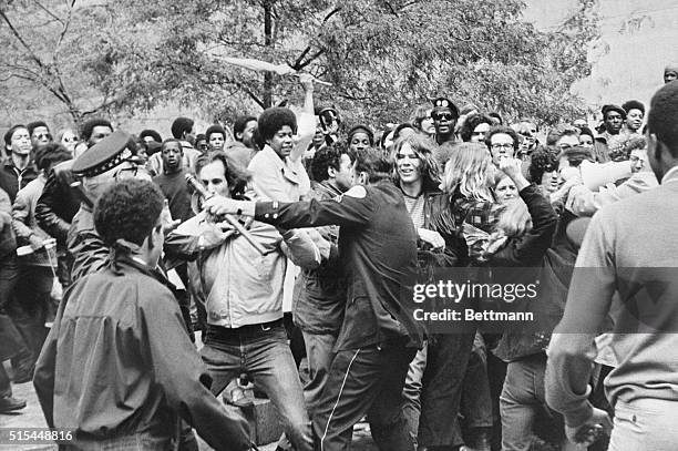 Chicago, IL- Demonstrators attack Chicago Police Captain Paul McLaughlin and an unidentified sergeant, during a clash outside the Federal Building,...