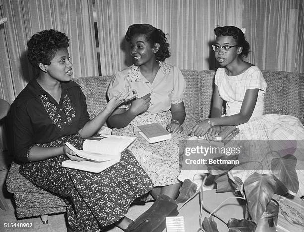 Little Rock, AK- Elated after spending their first full day at Little Rock Central High, three of the nine Negro students escorted to classes by...