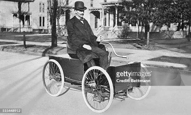 Henry Ford driving in his first automobile, the Quadracycle, on Grand Boulevard in Detroit, Michigan.