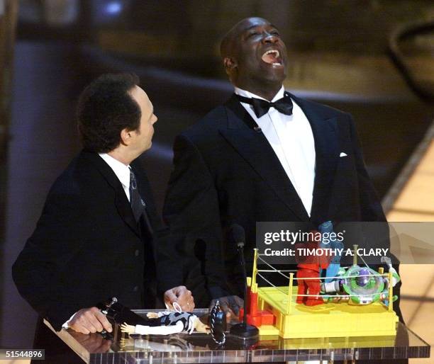 Academy Award ceremonies Host Billy Crystal and actor Michael Clarke Duncan present the Animated Action Short Film Oscar during the 72nd Academy...