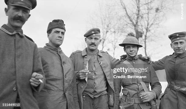 - German soldiers greet US soldier a few minutes after the armistice went into effect. Photograph, ca. World War I.