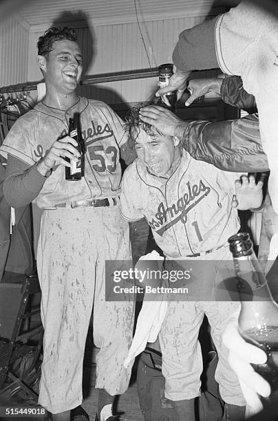 Chicago, Illinois- Targets of beer throwing teammates in the dressing room after the Dodgers won the World Series from the White Sox are pitcher Don...